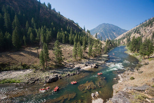 Rafters approach a bend in the Salmon River, deep in the mountains of Idaho.