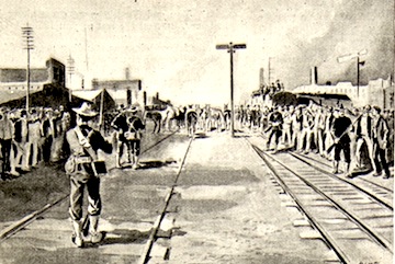 U.S. troops guard a railroad during the strike, in 1894.